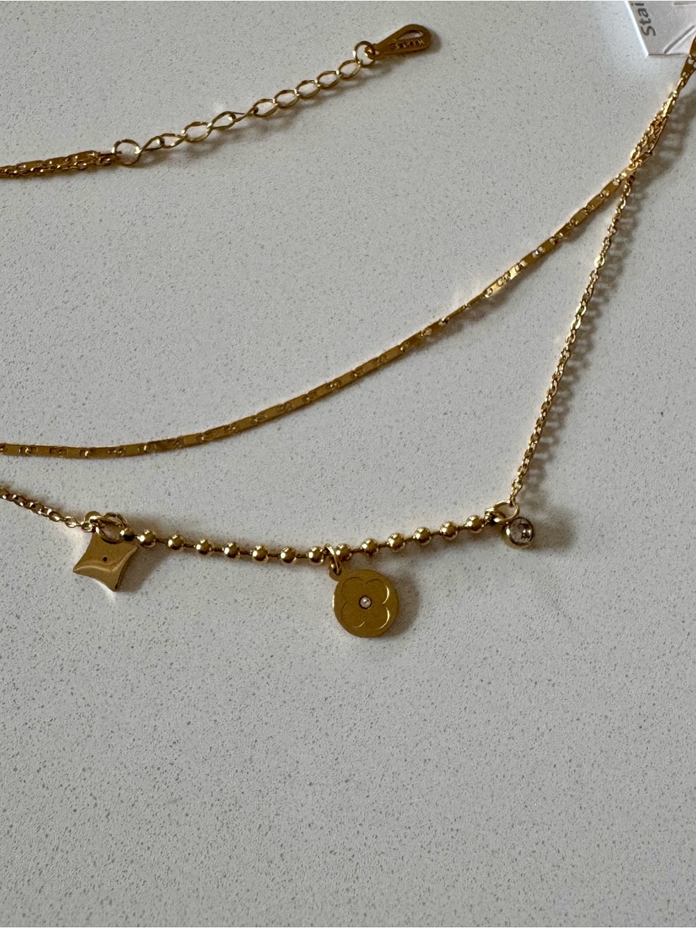 Layered Gold Charm Necklace with Disc and Geometric Accents